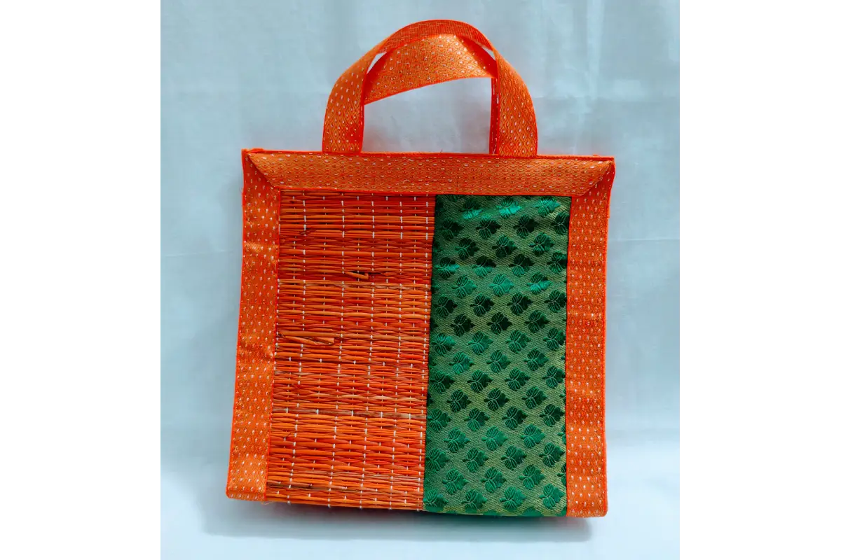 Assorted red green and gold brocade border Korai grass bags for festive gifting
