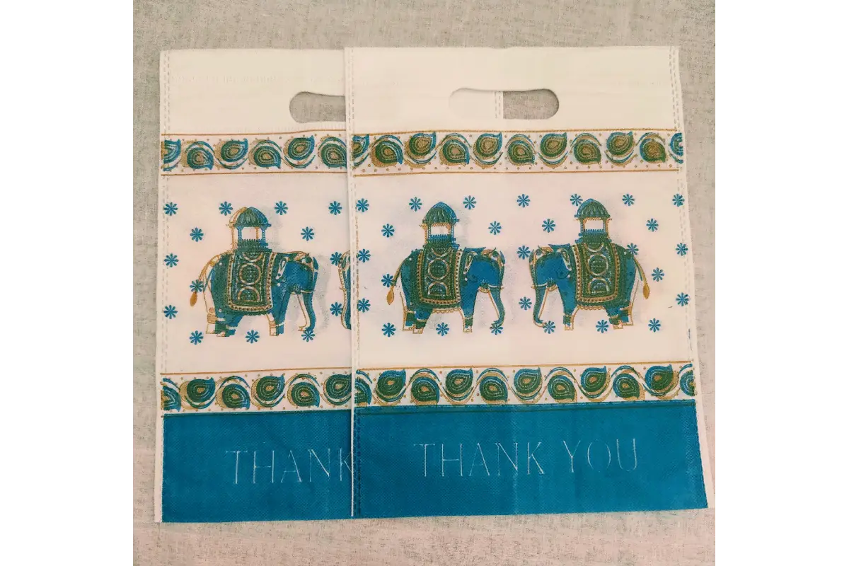 Assorted multi-colored Thank You printed Thamboolam favor bags available at Puja Celebrations