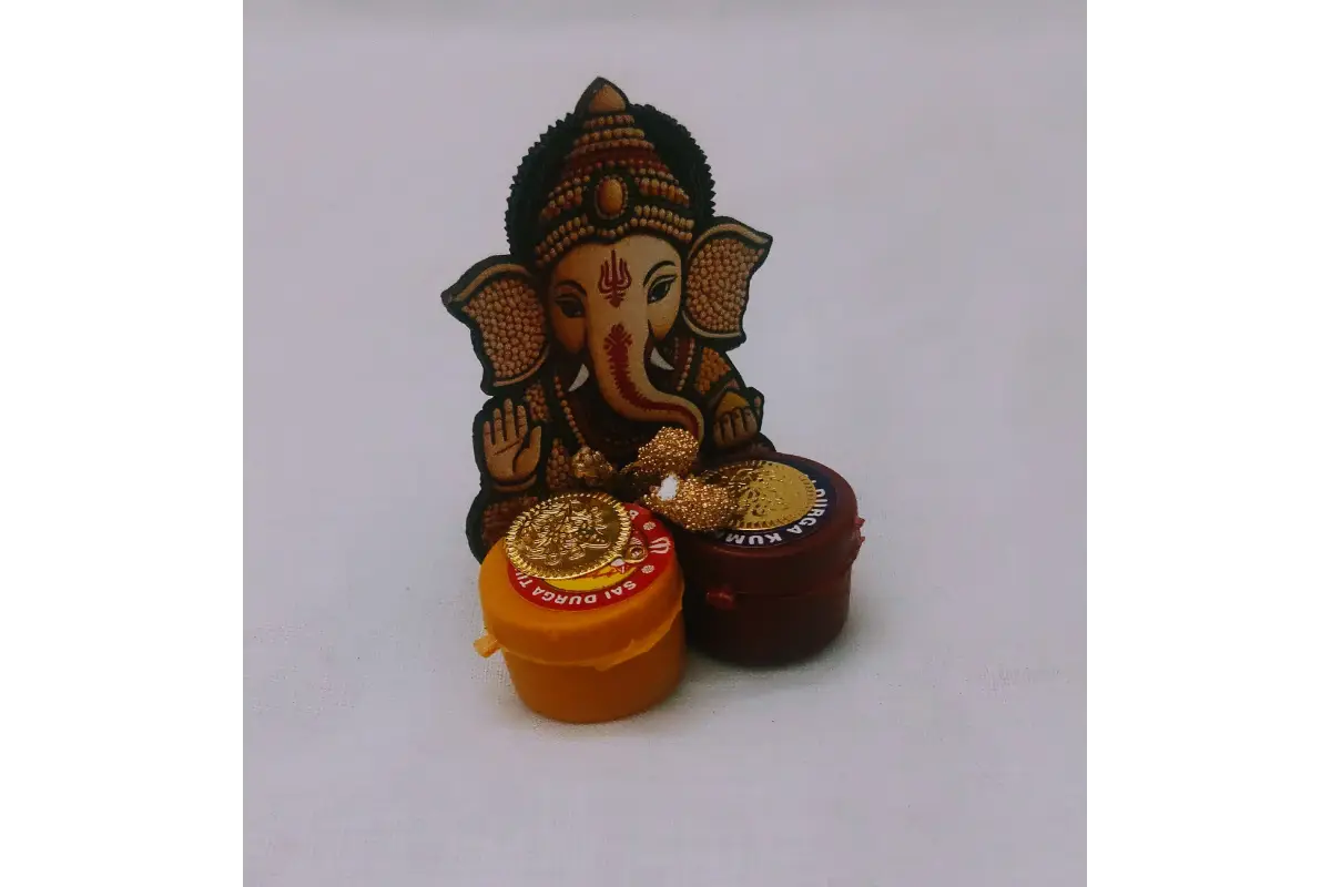 Ganesha Haldi Kumkum magnet attached to a refrigerator door as decorative accent