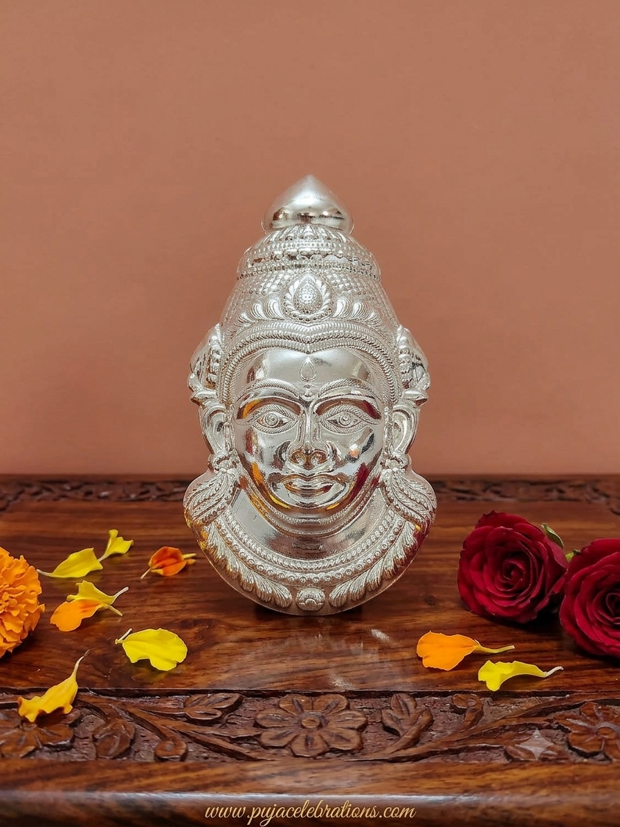 Finely detailed German Silver Goddess Gowri face with intricate crown and jewelry detailing, crafted for idol decoration during Varalakshmi Puja and Margazhi festivals.