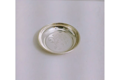 Close-up view of intricate floral embossing and mirror polish on German silver plate