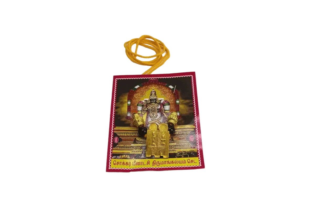 Meenakshi Thirumangalyam Thali set draped elegantly on a Varalakshmi Amman doll for pooja - Puja Celebrations