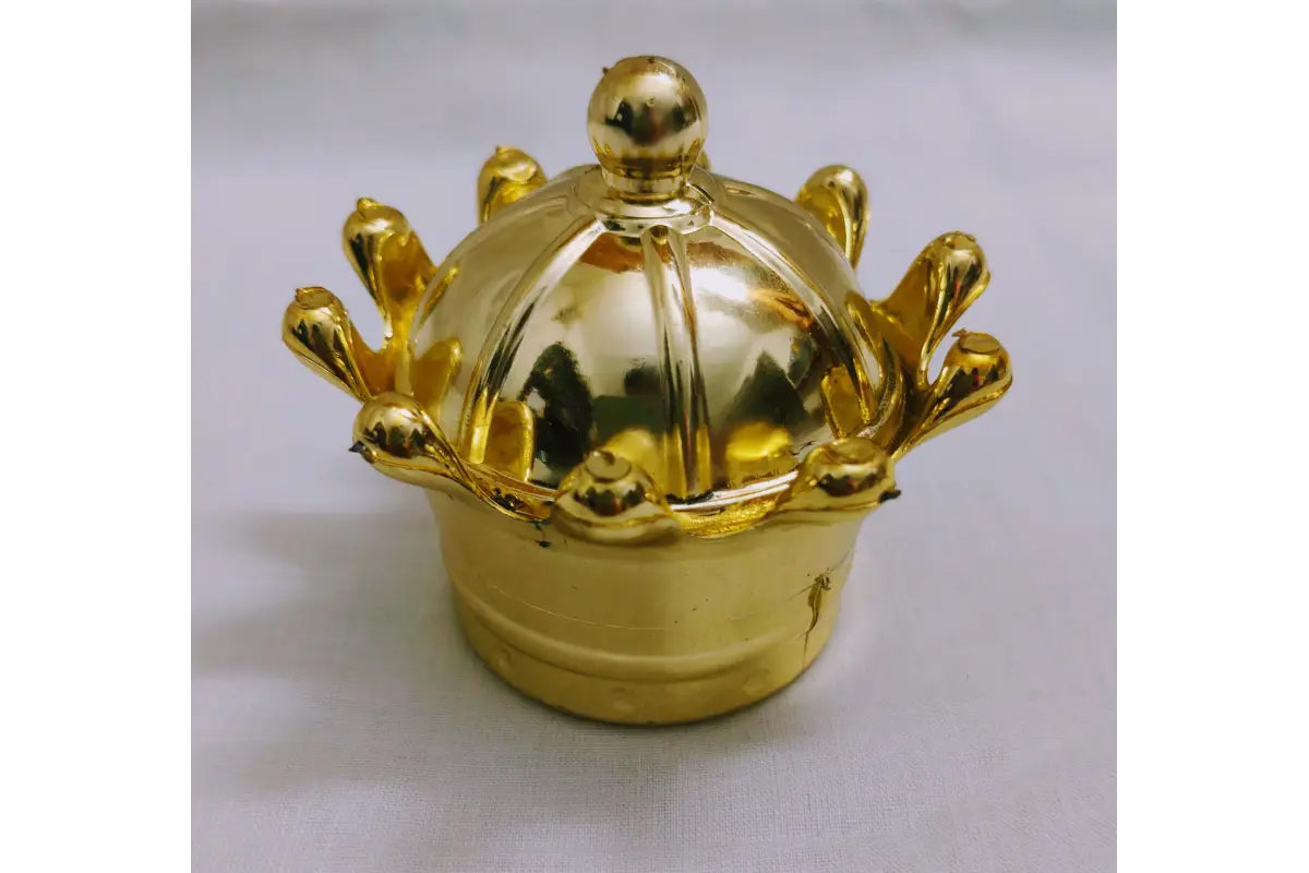 Close-up view of metallic gold finish and relief carving on fiber plastic gift box