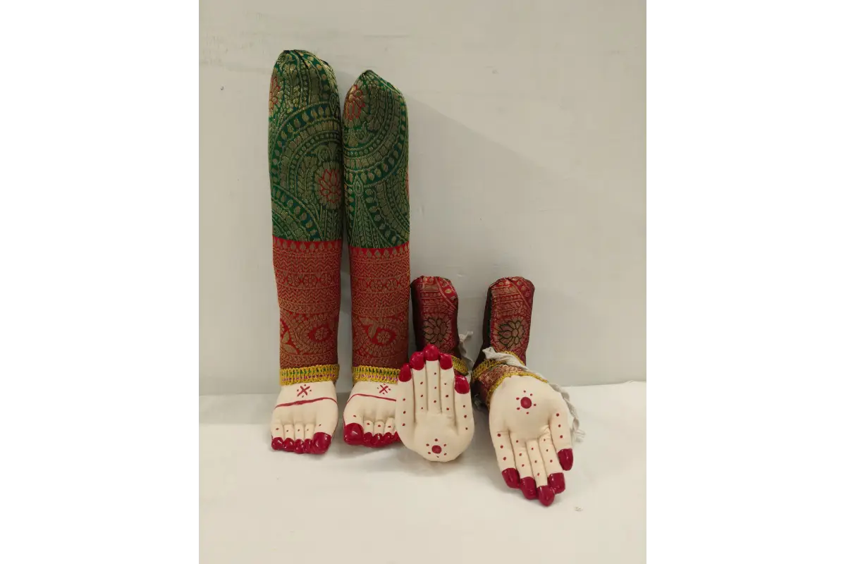 Colorful embroidered leg and foot dolls on a white background