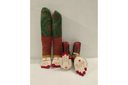 Colorful embroidered leg and foot dolls on a white background