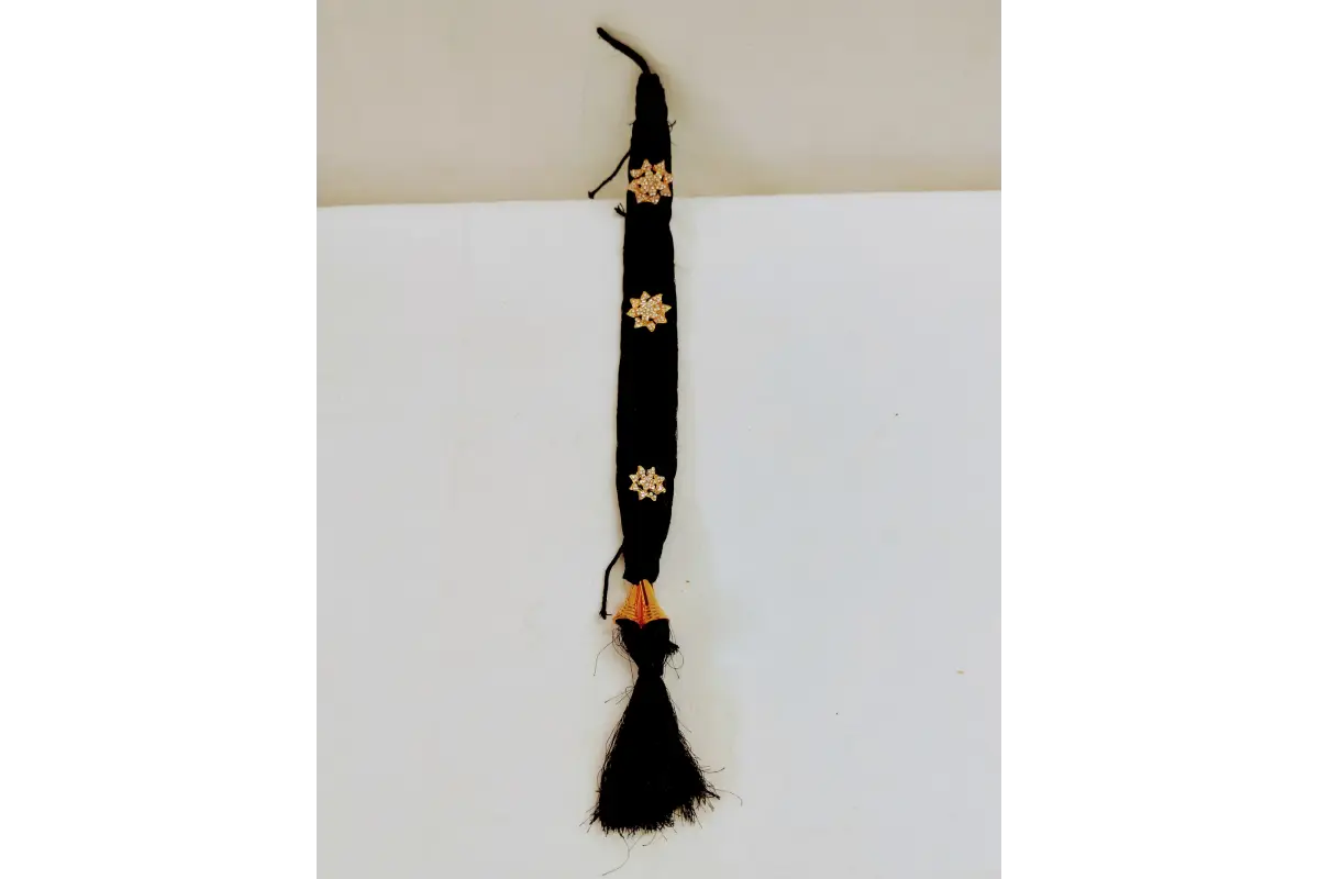 Black belt with gold floral patterns on a white background