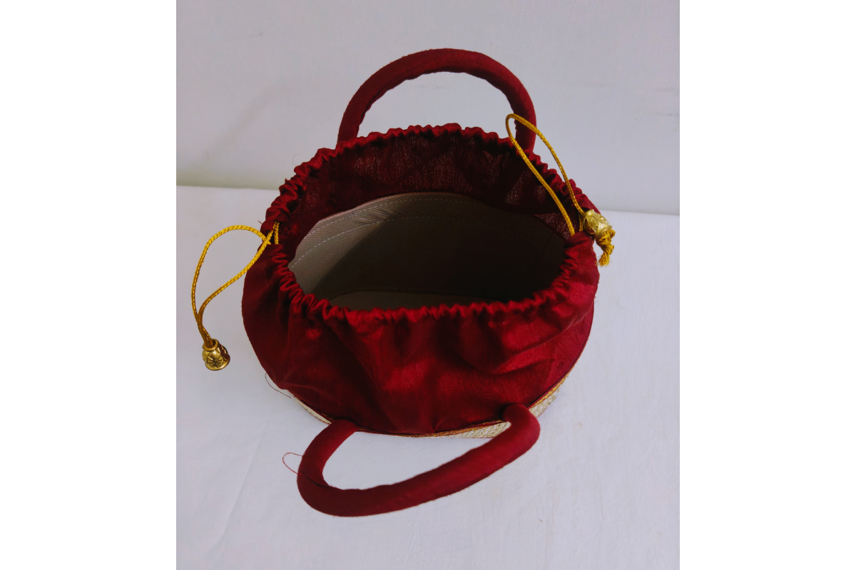 Traditional Korai dry grass potli bag with drawstring closure for wedding return gifts