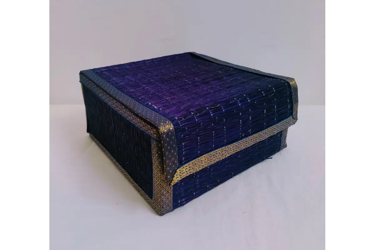 Close-up view of woven natural korai grass texture and decorative lid fabric trim