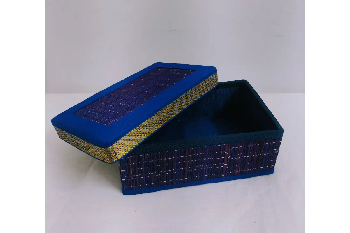 Korai grass gift box arranged in housewarming thamboolam setup with coconut and flowers