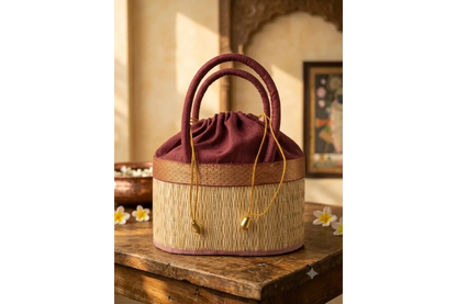 Close-up view of natural Korai grass weave texture and colored fabric border on potli bag