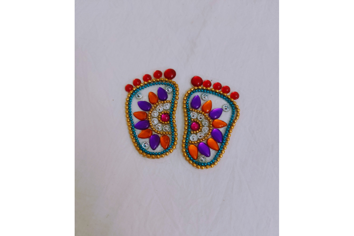 Pair of left and right Krishna Padam rangoli stencils available in acrylic materials