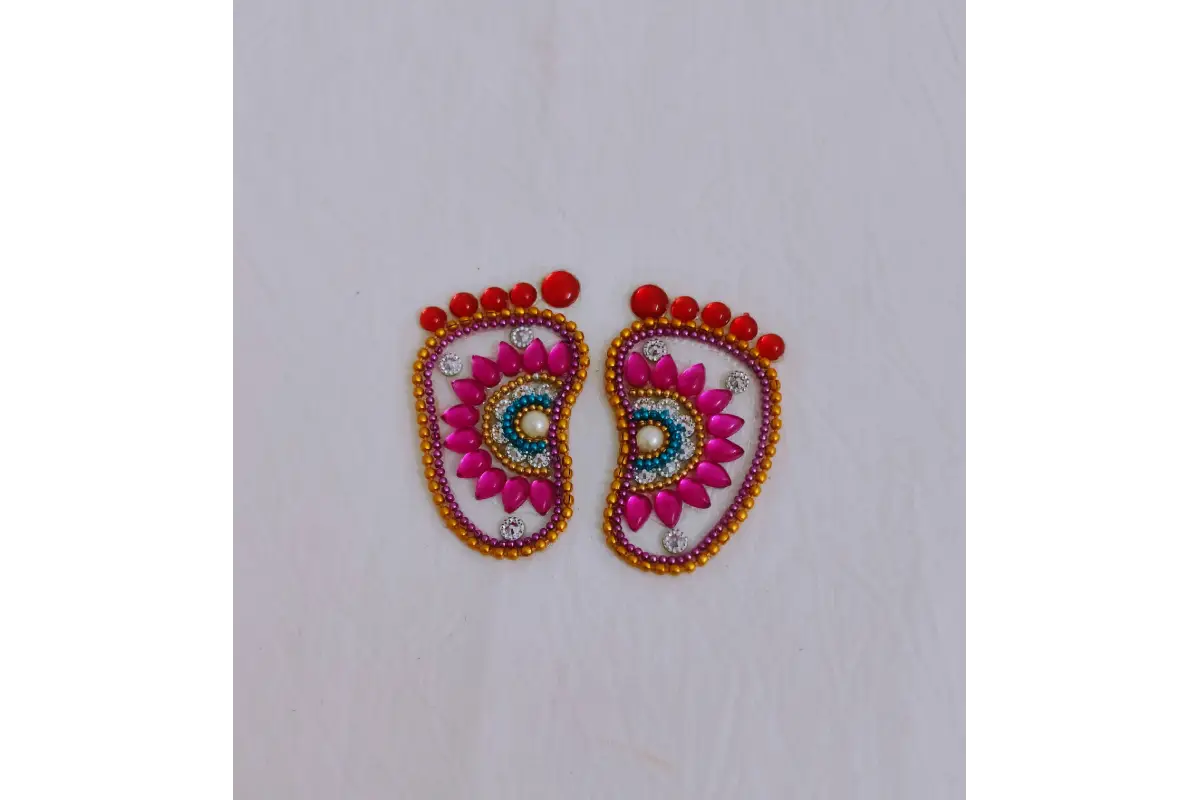 Krishna Padam rangoli stencil arranged in Gokulashtami thamboolam gift hamper with sweets
