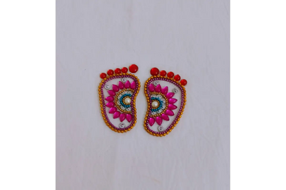 Krishna Padam rangoli stencil arranged in Gokulashtami thamboolam gift hamper with sweets