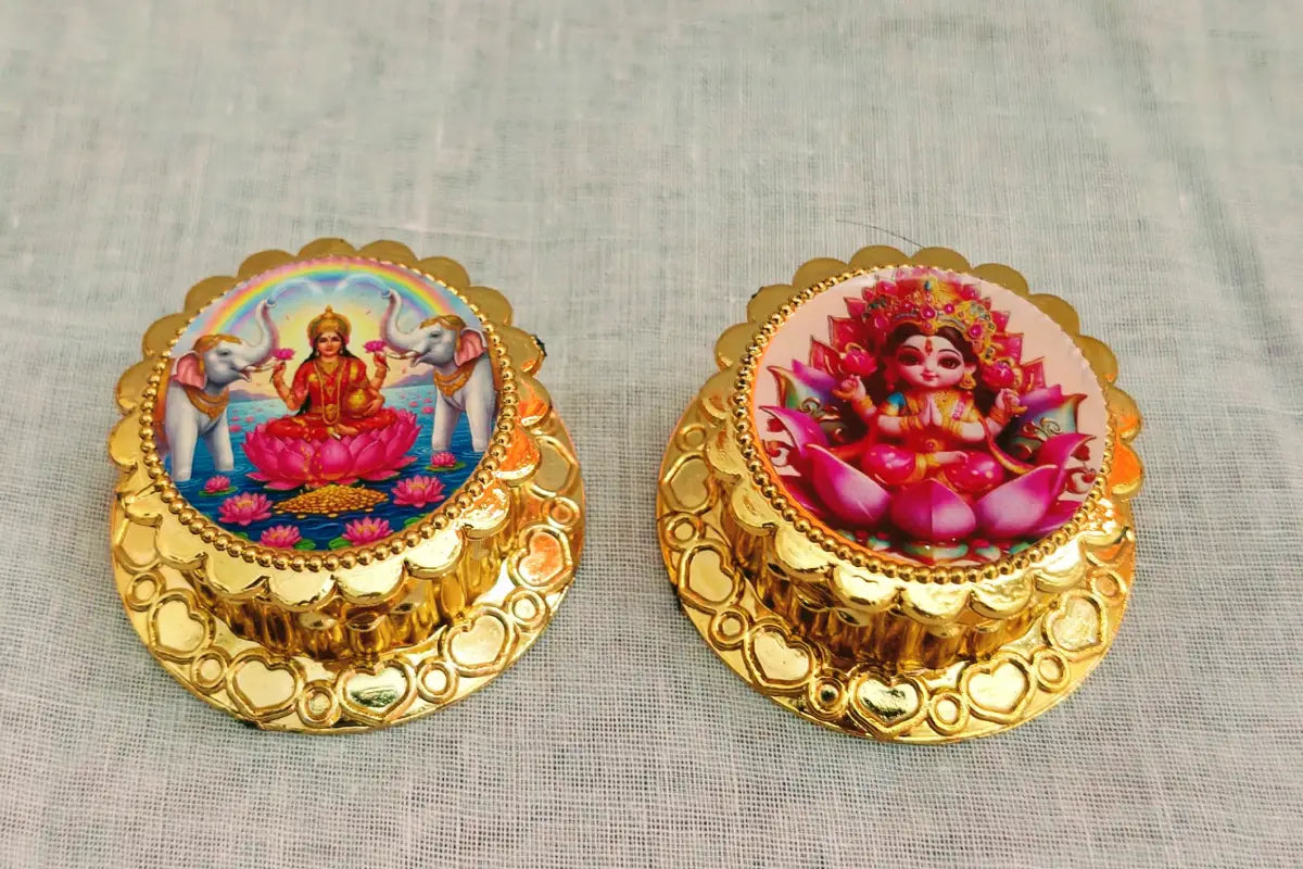 Compact Lakshmi kumkum dabba held in hand showing realistic dimensions for gifting