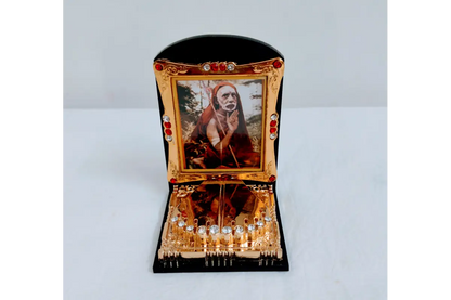 Maha Periyava Charan Paduka frame mounted on a car dashboard for divine travel safety