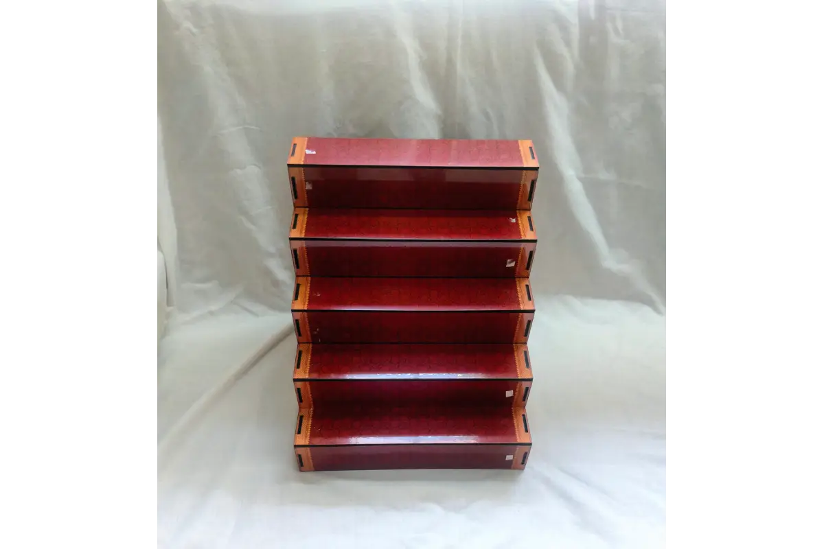 Compact MDF mini Golu stand held in hand showing realistic proportions for gifting