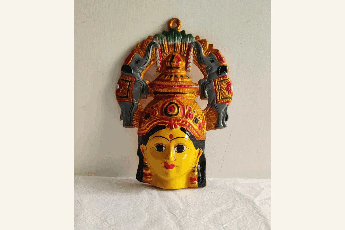 Intricate facial features and dual elephant prabhavali arch details on Goddess Lakshmi mugam idol - Puja Celebrations