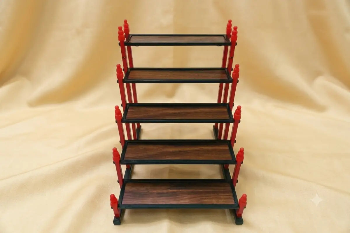 Top angle view of mini Golu stand showing wide step depth for miniature idols