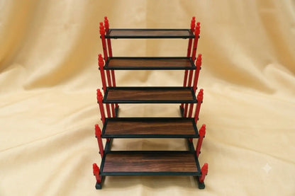 Top angle view of mini Golu stand showing wide step depth for miniature idols