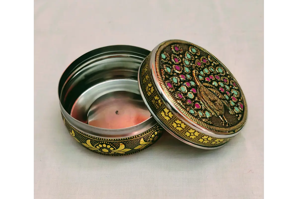 Open embossed steel box showing smooth interior storage for sweets, dry fruits, and kumkum