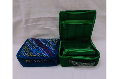 Open designer fabric jewelry pouch showing soft inner lining for gold and imitation accessories