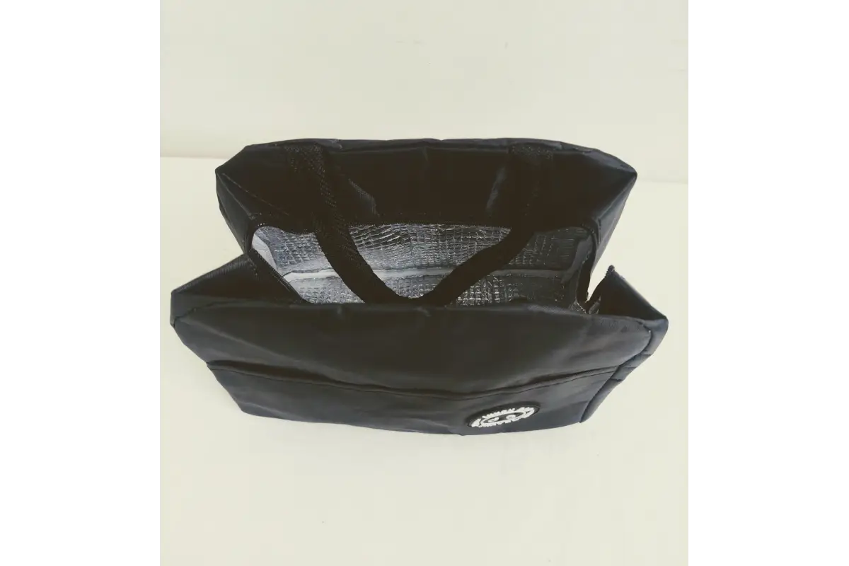 Open top view of insulated lunch bag holding meal container and water bottle