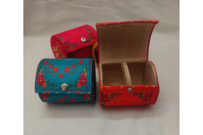 Open printed bangle organizer showing inner velvet lining and central holding rod