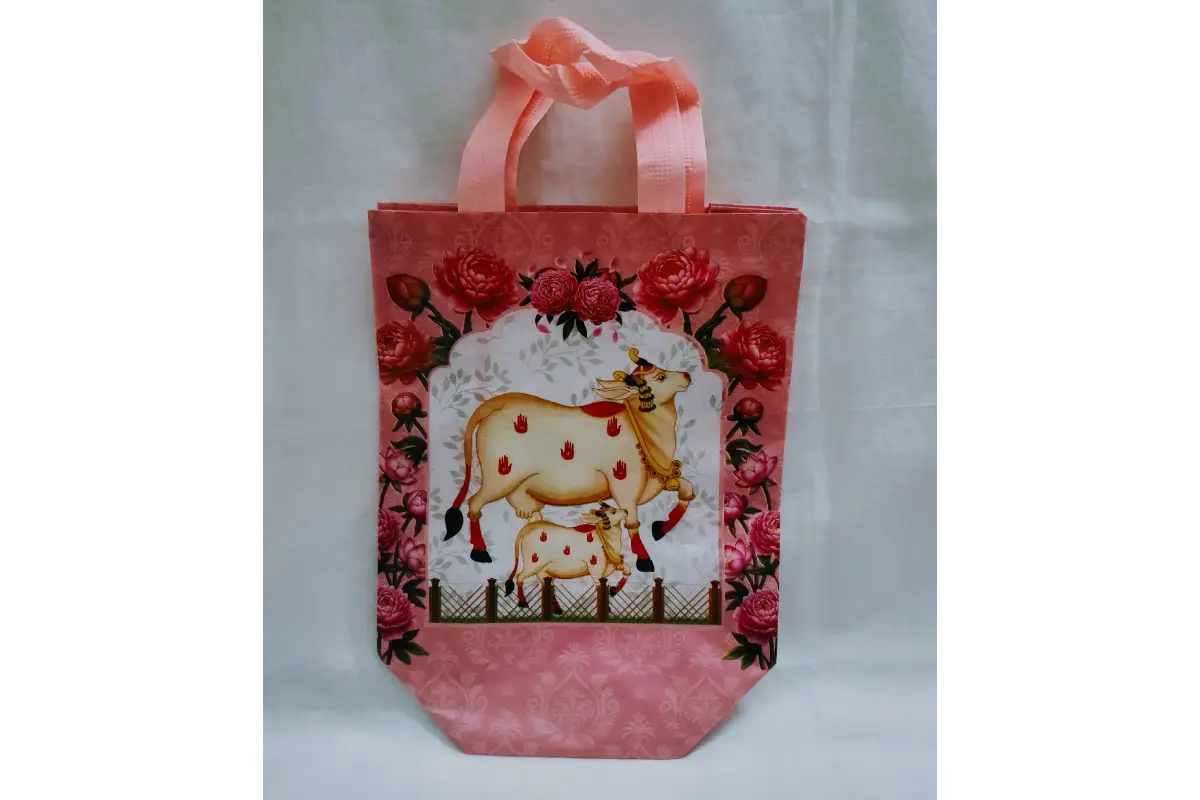Detail view of sturdy padded cotton handles and strong side stitching on Pichwai printed bag