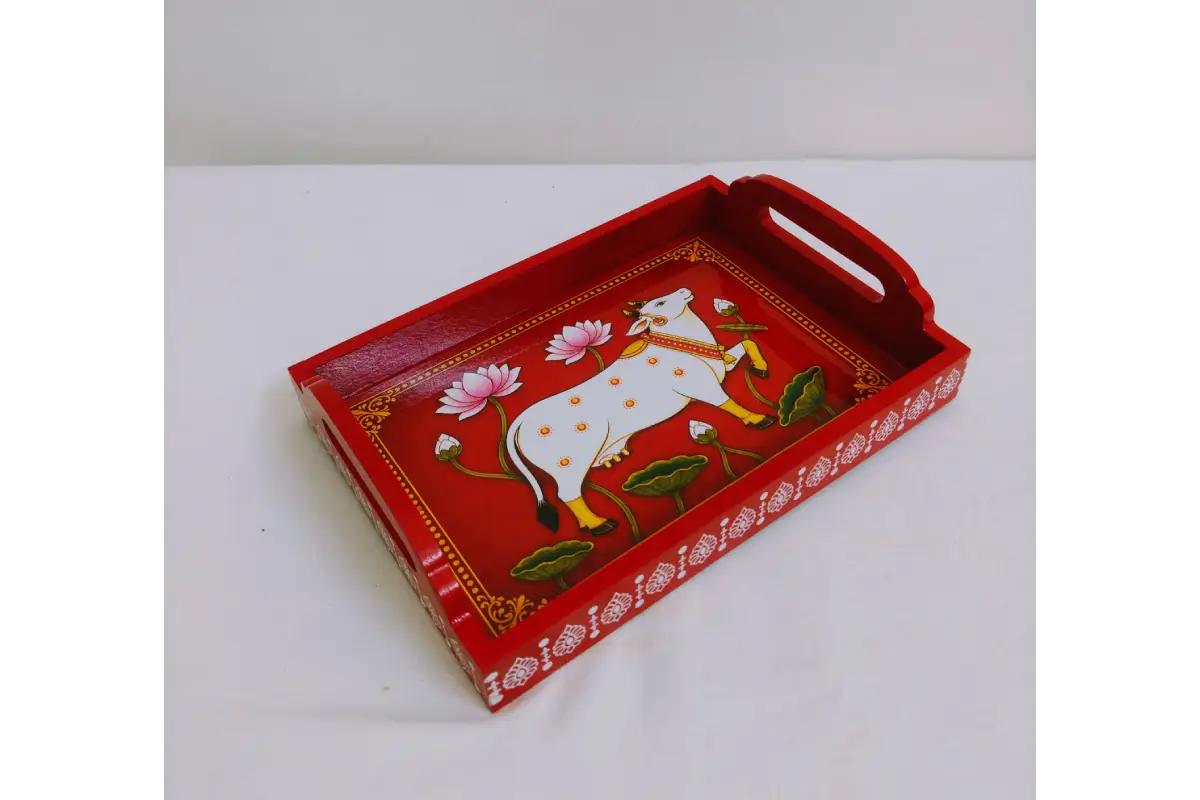 Detail view of sturdy cut-out side handles and raised edges on Pichwai print wooden tray