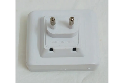 Detail view of two-pin power plug and integrated power switch on LED night lamp base
