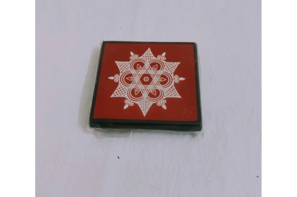 Printed wooden manai patla held in hands showing compact size for return gifting