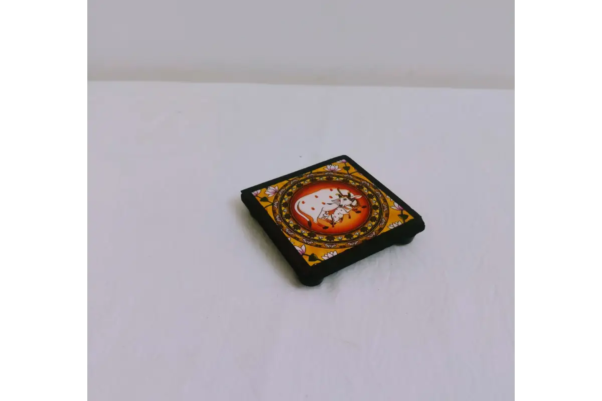 Wipe-clean waterproof surface demonstration on printed wooden pooja manai