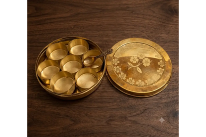 Single brass spice bowl removed from Anjarai Petti showing cup depth and thickness