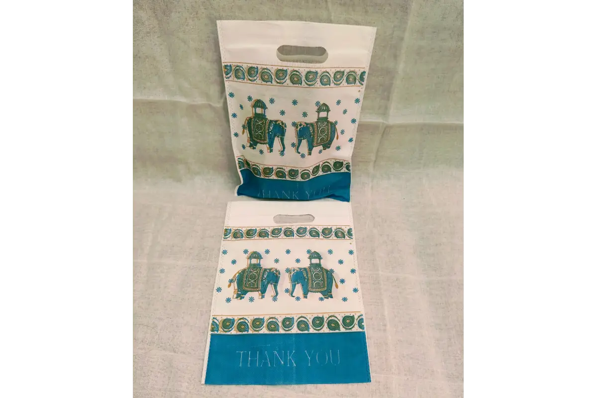 Close-up view of gold foiled Thank You lettering and durable padded handles on Thamboolam bag