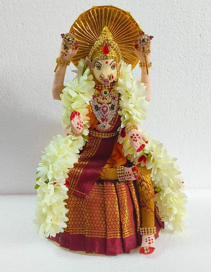 lose-up of Sapta Matrika Varahi Bommai face showing hand-painted details and stone-studded crown - Puja Celebrations