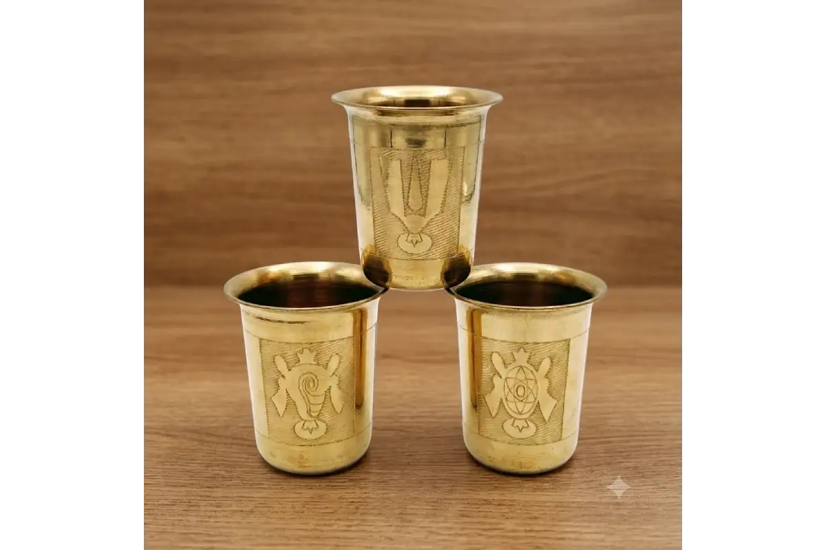 Close-up view of embossed Shanku Chakra Namam sacred symbols on metal tumbler