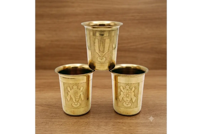 Close-up view of embossed Shanku Chakra Namam sacred symbols on metal tumbler