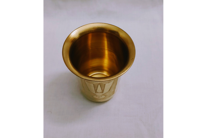 Traditional Shanku Chakra Namam glasses arranged for pooja room offerings