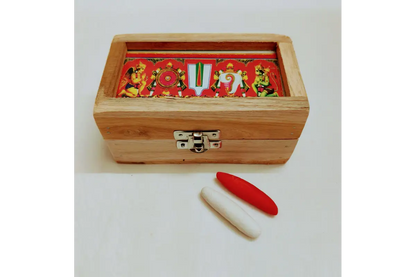 Wooden jewelry box with a red and gold interior, accompanied by a red and white object on a white background