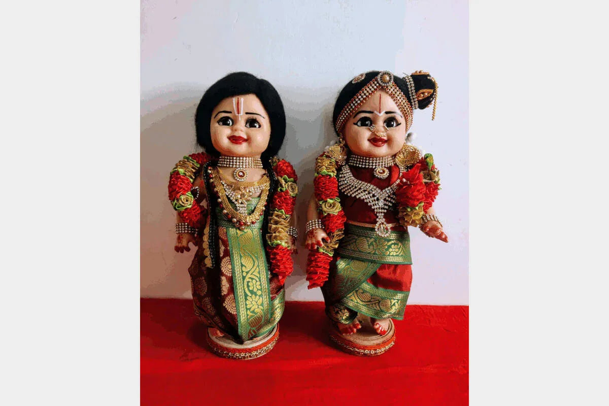 Iyengar Mama Mami dolls beautifully arranged on a wooden step stand for Navaratri Golu decoration - Puja Celebrations
