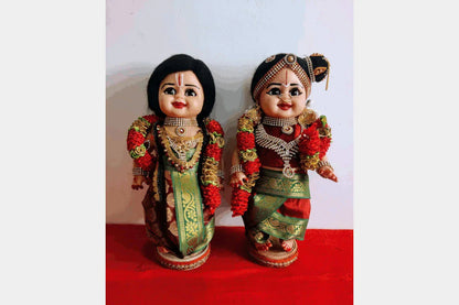 Iyengar Mama Mami dolls beautifully arranged on a wooden step stand for Navaratri Golu decoration - Puja Celebrations