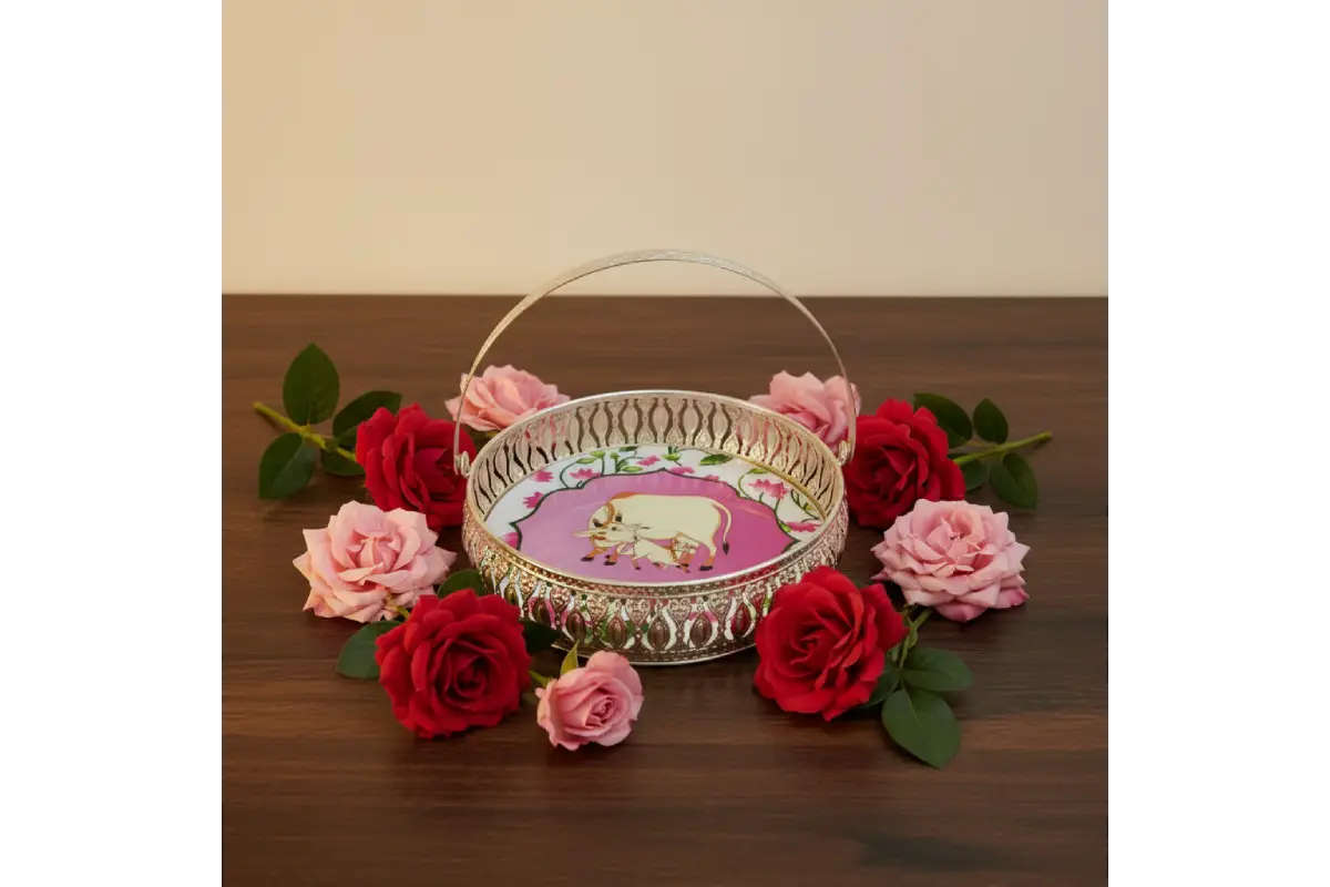 Decorative basket with a pig design surrounded by red and pink roses on a wooden surface.