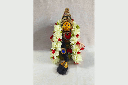 Different sizes of Varalakshmi Ammavari doll sets with pre-decorated faces and colorful sarees - Puja Celebrations