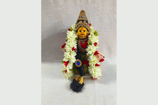 Different sizes of Varalakshmi Ammavari doll sets with pre-decorated faces and colorful sarees - Puja Celebrations