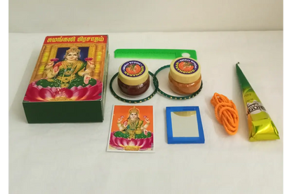 Thamboolam Sumangali return gift set placed beside a decorated Varalakshmi Amman Kalasam