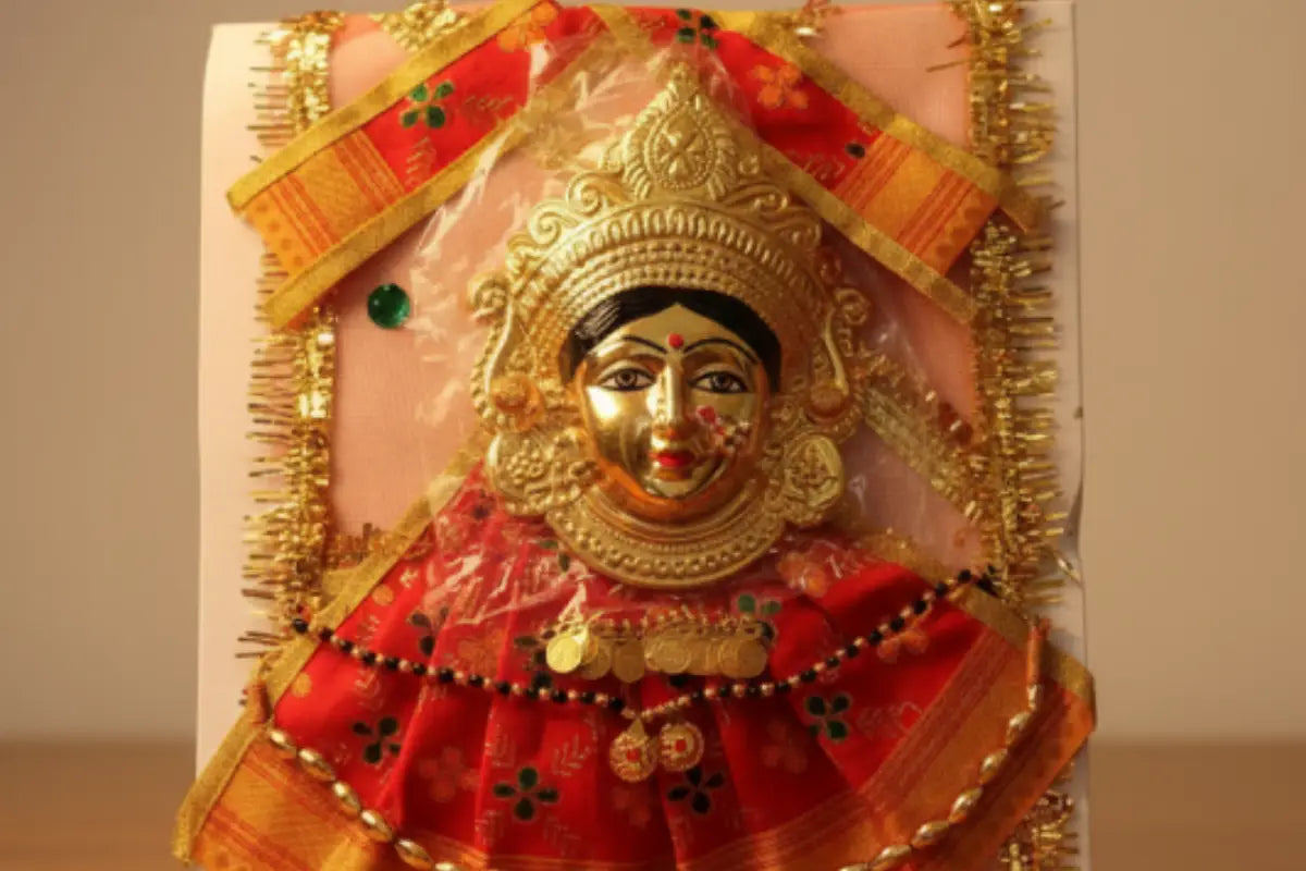Decorative item with a gold and red design on a plain background