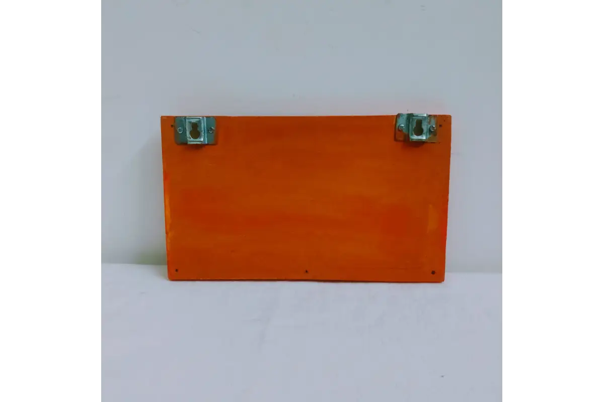 Back perspective of wooden Warli keyholder showing pre-installed wall mounting slots