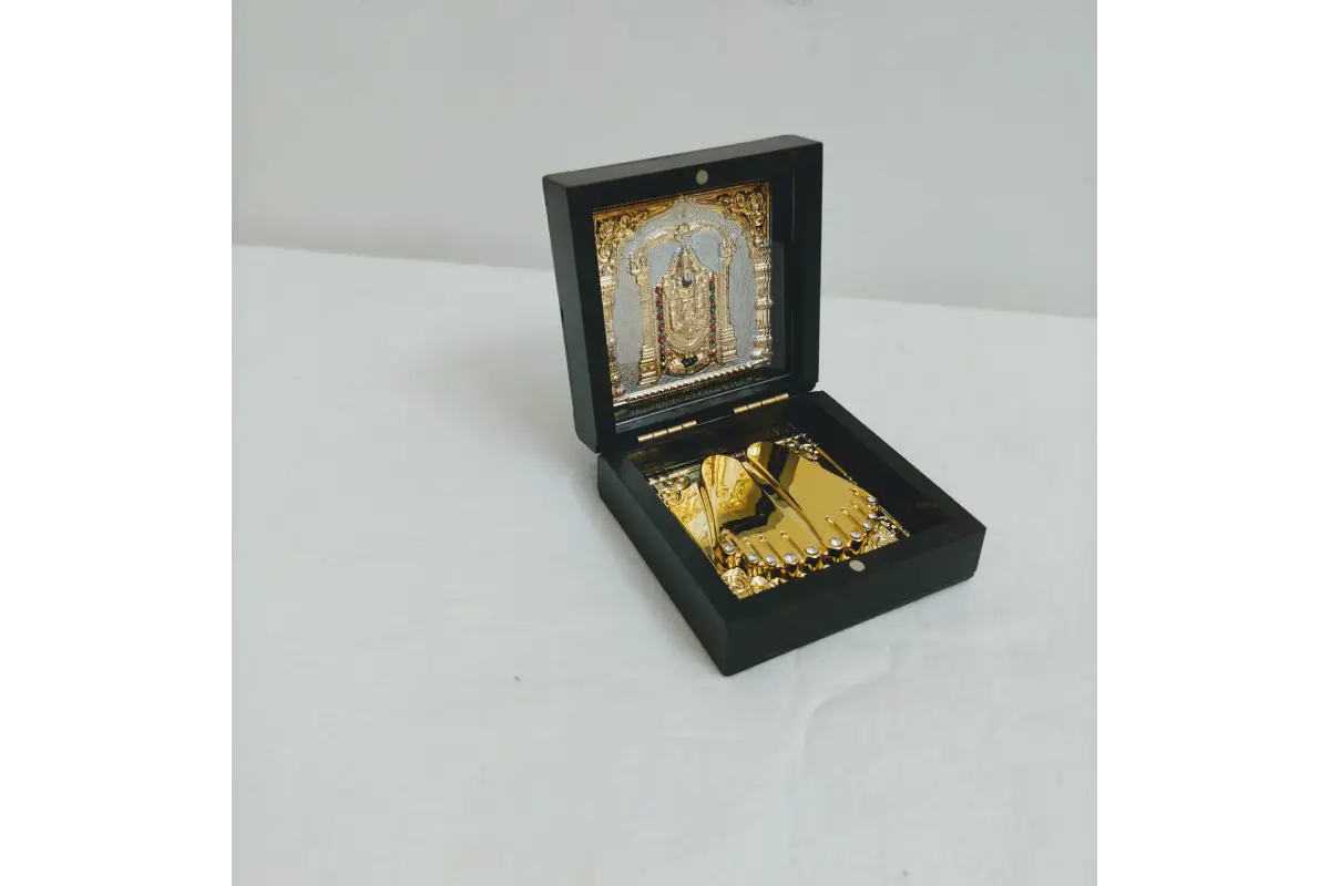 Bulk stock of Lord Balaji Charan Paduka boxes packed for wholesale return gift orders at Puja Celebrations