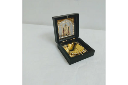 Bulk stock of Lord Balaji Charan Paduka boxes packed for wholesale return gift orders at Puja Celebrations