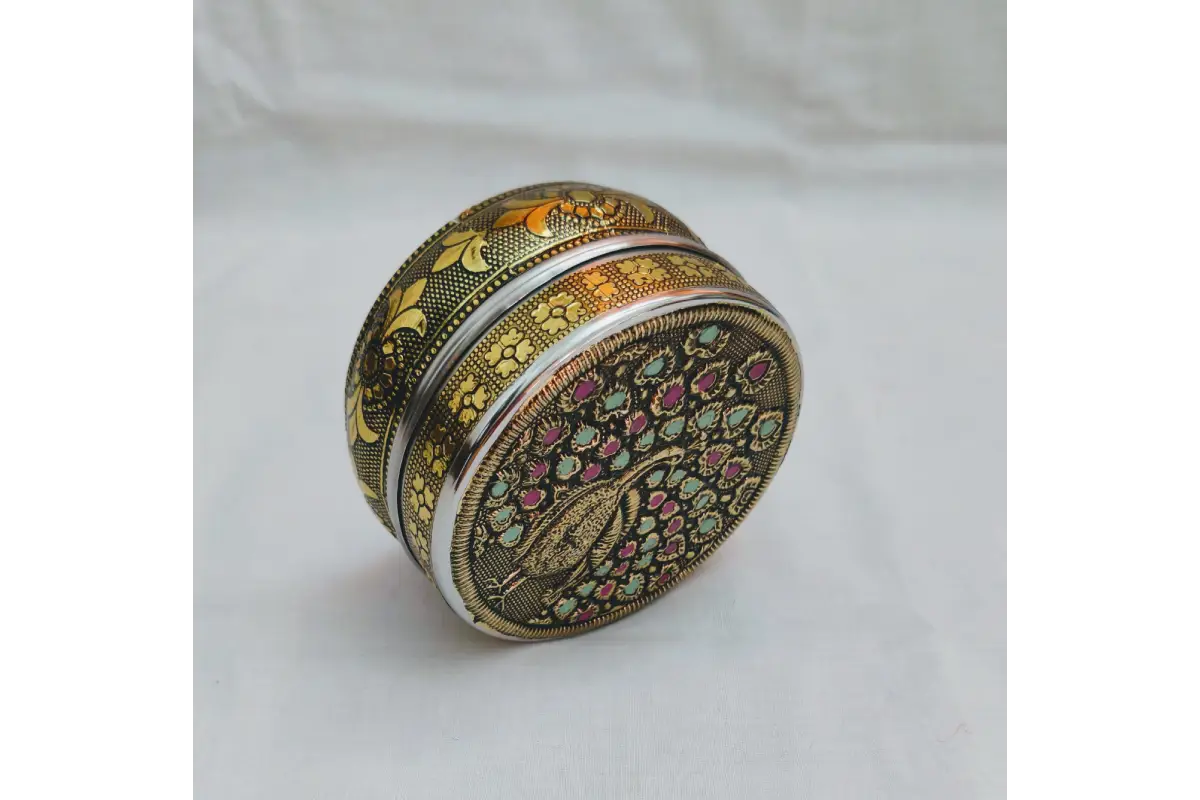 Bulk stock of traditional embossed stainless steel boxes ready for wholesale return gift orders at Puja Celebrations